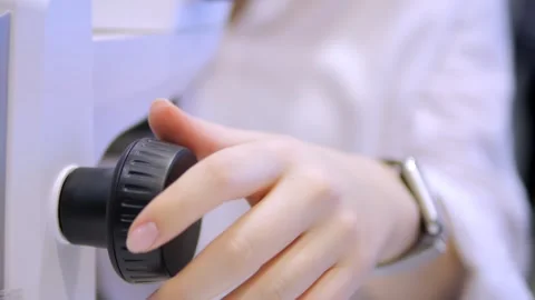 A person is holding a knob on a white object Stock Footage 297734270