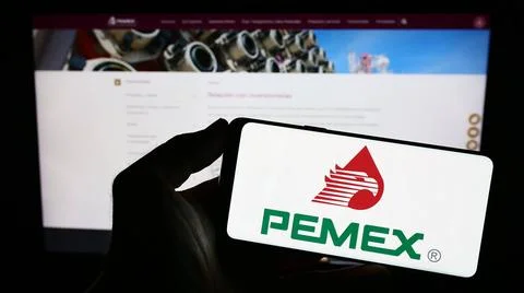  Person holding mobile phone with logo of oil company Petroleos Mexicanos ... Stock Photos
