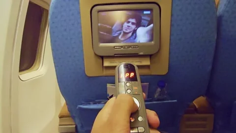 A person holding a remote control device in their hand Stock Footage 291892604