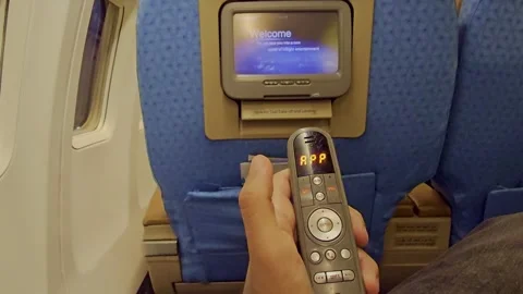 A person holding a remote control device in their hand Stock Footage 291905091