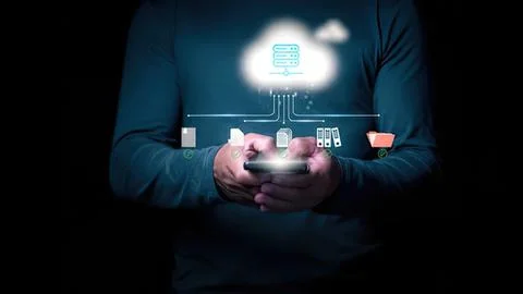 Person holding smartphone with cloud computing icons 写真素材