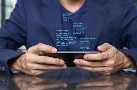 Person Holding Smartphone with Code Data Visualizations Displayed Foto stock