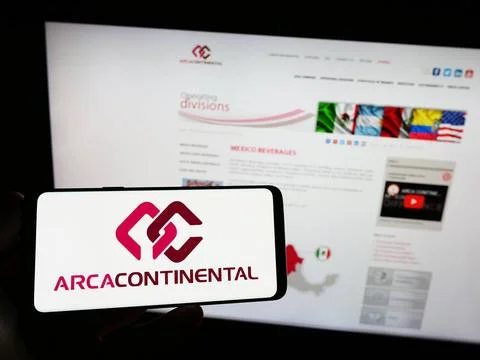  Person holding smartphone with logo of company Arca Continental S.A.B. de... Stock Photos