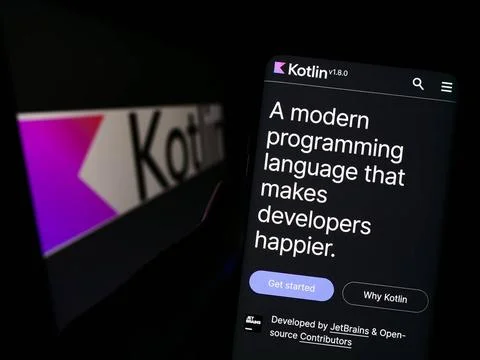 Person holding smartphone with website of programming language Kotlin on s... Stock Photos