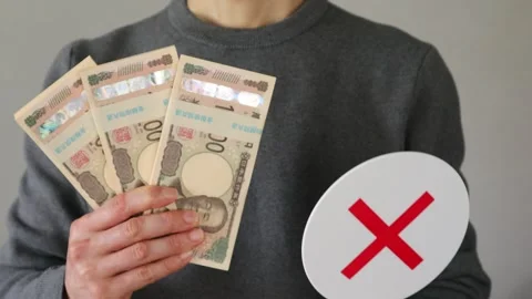 A person holding a stack of bills and a cross Video stock 324544261