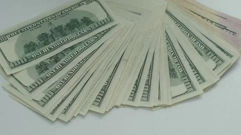 A person is holding a stack of US dollars Stock Footage 314112789