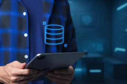 Person Holding Tablet with Data Visualization in Digital Environment Stock Photos