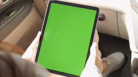 Person is holding a tablet with a green screen Stock Footage 316976008