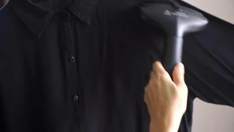 Person holding a tablet or device with a green screen Stock Photos