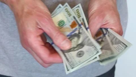 Person holding through money stack in hands Stock Footage 309087149
