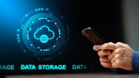 Person holds smartphone while looking at cloud data storage graphic on a screen Foto stock