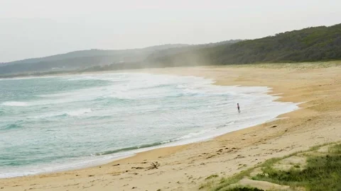 Person hopping out of the ocean Stock Footage 327332809