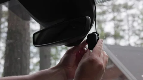 A person inserting memory card into a dash camera. Horizontal 60fps. Stock Footage 341361327