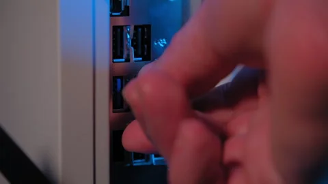 Person is inserting a USB flash memory in a computer Stock Footage 267721250