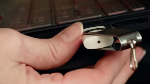 Person is inserting a USB stick in a laptop computer, Usb flash memory and co Stock Footage 211807653