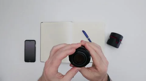 Person inspecting camera lens Stock Footage 64542308