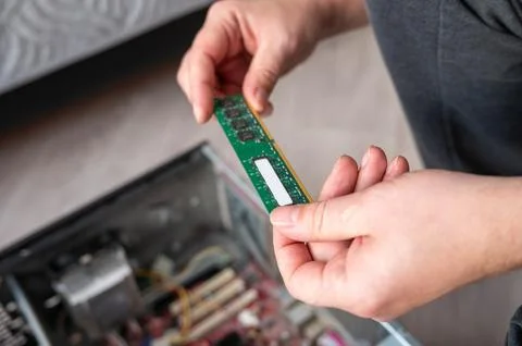 Person installing ram in desktop computer for hardware upgrade Stock Photos