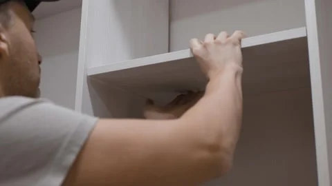 Person Installing Shelves Stock-Footage 301565067