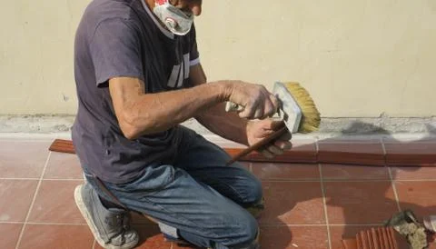 Person intent on fixing and instiling and repairing craftsman at work Stock Photos