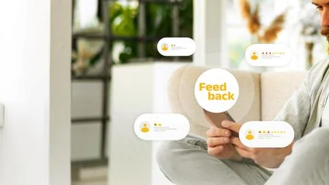 Person interacting with feedback on a mobile device in a bright indoor space Stock Photos