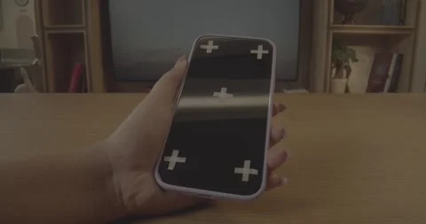 Person interacting with a mobile phone screen with tracking crosses. Stock-Footage 330156110