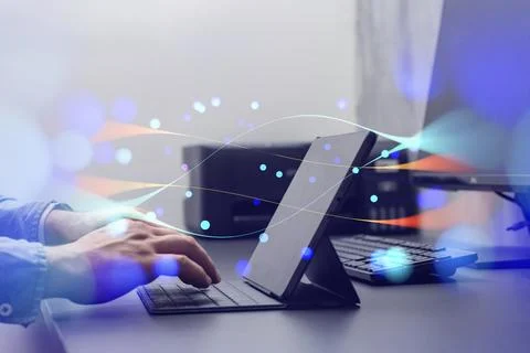 Person interacting with a tablet device with abstract network effects, symbol Stock Photos