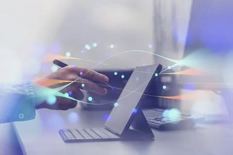 Person interacting with a tablet device with abstract network effects, symbol Stock Photos