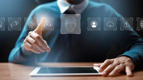 Person interacts with tablet displaying digital icons related to technology and 写真素材