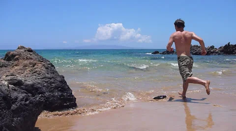 Person Jumping in Refreshing Ocean Stock Footage 24241931