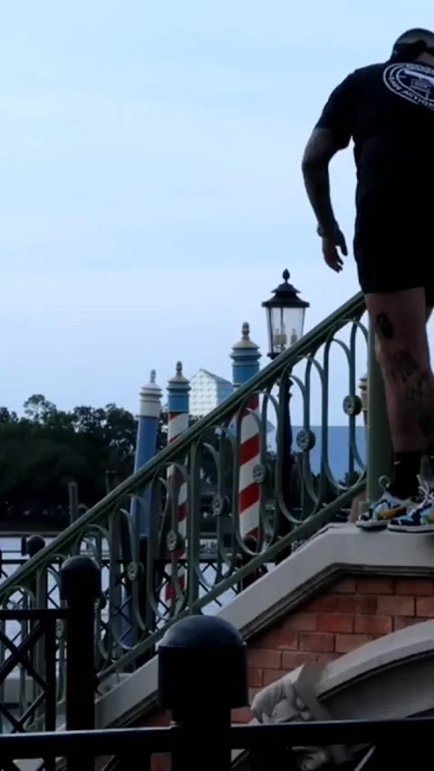 Person Jumps Into Water at Epcot, Epcot, Walt Disney World Resort, Bay Lake, Flo Stock Footage 255789380