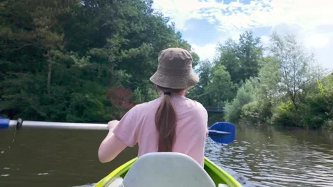Person Kayaking Forward On Calm River Stock Footage 331322892