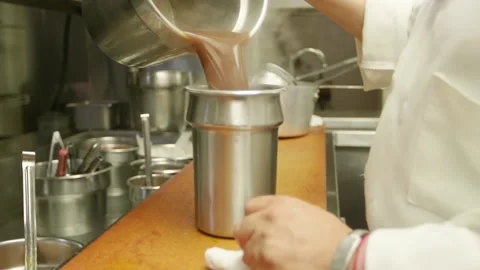 A person in a kitchen preparing food Stock Footage 155451951