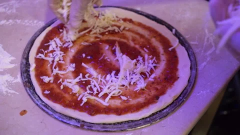 Person Kneading Cheese on Pizza Stock Footage 268720344