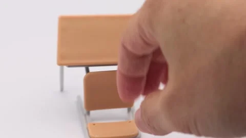 A person knocks over a desk and chair. Video stock 336657465