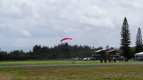 Person Landing While Paragliding Above Landscape During Vacation - Oahu, Hawaii Stock-Footage 154608939