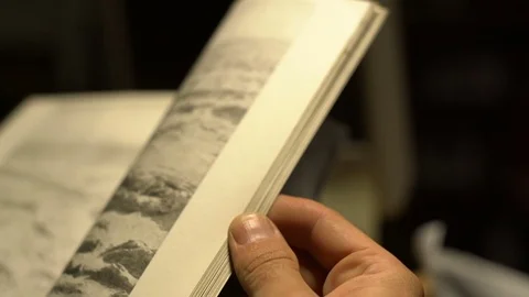 Person leafing through a book close-up Stock Footage 72203404