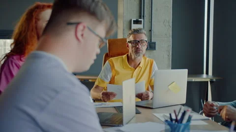 Person with learning disability raising hand during meeting Stock Footage 278798539