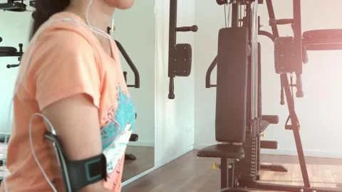 Person Lifting Weights in a Gym Setting Stock Footage 314636880
