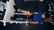 Person Lifts Weight With Prosthetic Leg In A Gym, Top View. Stock Footage