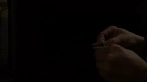 Person lighting a fire with a match Stock Footage 44069765