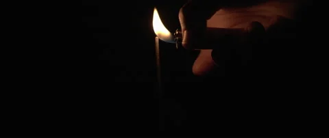 Person lighting up a sparkler with a lighter. Stock Footage 132966150