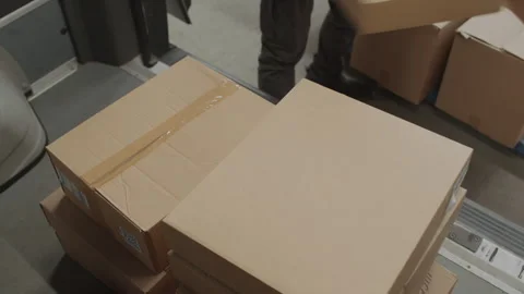 Person Loading Parcels in Car while Preparing for Delivery 動画素材 256066015