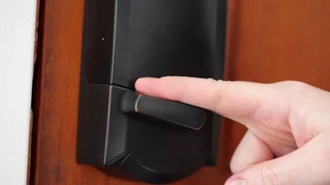 Person locking a smart lock in slow motion Stock Footage 307155510