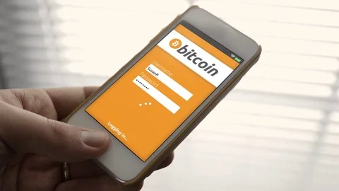 Person logging into a bitcoin website page on a smartphone Video stock 84871836