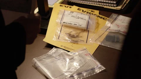 Person looking at evidence documents Stock Footage 67553737