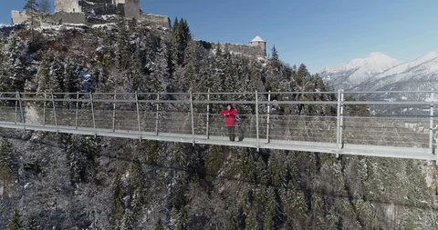 Person looking out over view on highline walkway path in Austria Stock Footage 102489621