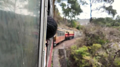 A person looking out of a train window at the engine. Stock Footage 333901788