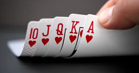 A person looking at a Royal flush An ace-high straight flush, the best possible Video stock 259461112