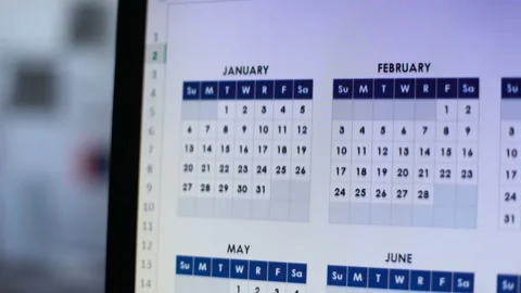 Person looking through calendar on pc, planning annual lending, installment Vídeo Stock 104040029