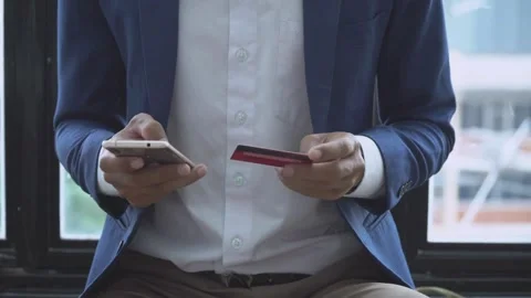 Person makes payment via on-line web store credit card data using laptop and Stock Footage 265927492
